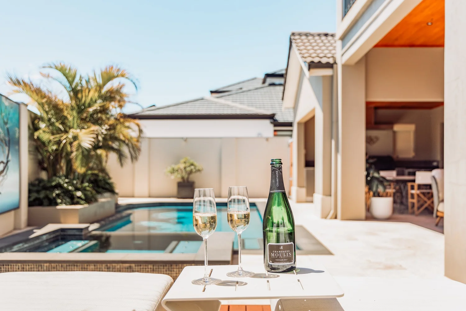 Champagne beside the heated pool at The Iluka Mirage